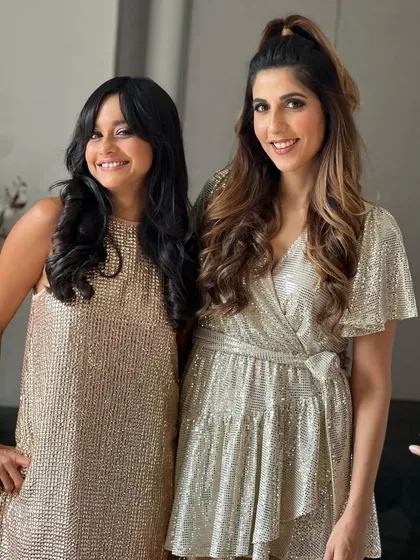 A half-ponytail is always a winning choice. I styled Simone Khambatta's hair in this fun and flirty look, while giving her friend Chef Chinu Vaze some lovely soft curls.