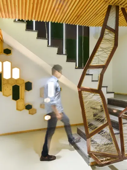 For the AMG Real Estate Office, I transformed a challenging basement space into a dramatic, modern lobby. The design uses an open-plan layout and a striking staircase to create a sense of openness and aesthetic harmony, setting a sophisticated tone from the moment of entry.