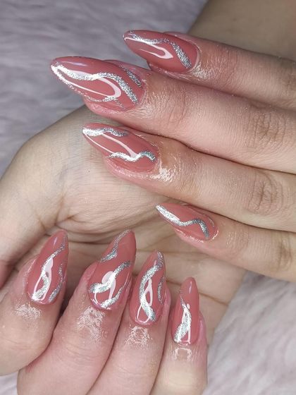 A unique design with a dusty rose base and abstract silver glitter swirls.