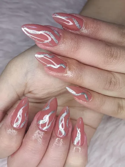 A unique design with a dusty rose base and abstract silver glitter swirls.
