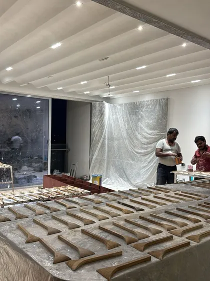Our craftsmen preparing the individual wooden elements for the 3D wall panel in the 'ARAH' project. It's a bold concept that required meticulous execution.