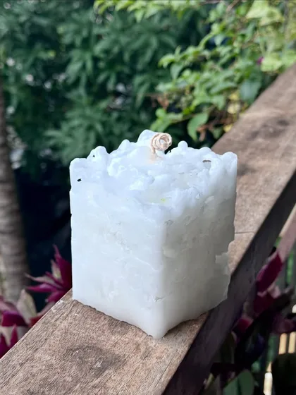 I'm always experimenting with new textures. This was a trial for a new product, a square pillar candle with a rough, icy texture.