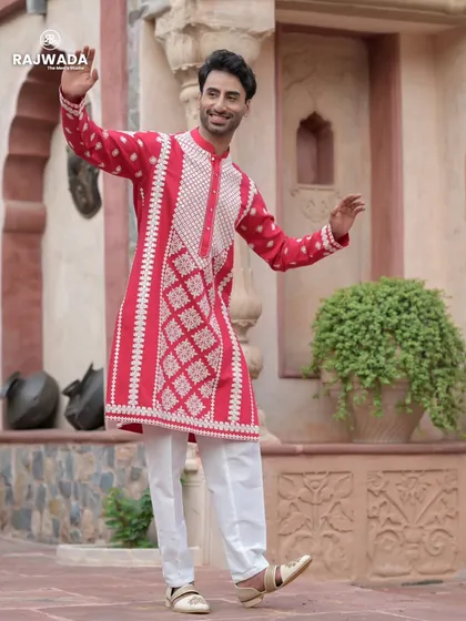 A vibrant red kurta from the Riwayat collection, perfect for festive celebrations. The intricate white embroidery on the front panel provides a beautiful contrast, creating a joyful and stylish look.