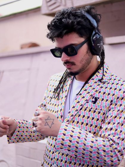 Checking the time, but the party is just getting started. My goal is to create a seamless flow of music that builds throughout the event, keeping guests engaged and entertained.