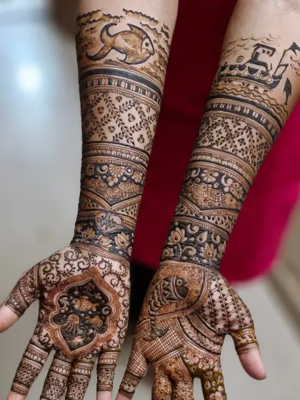 A unique Koli-themed mehendi for a bride from the fishing community. The design features elements like a fishing boat and fish, celebrating her cultural heritage.