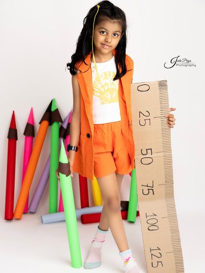 A change of outfit for a different look within the same 'Back to School' theme. I offer multiple wardrobe options to add variety to the session.
