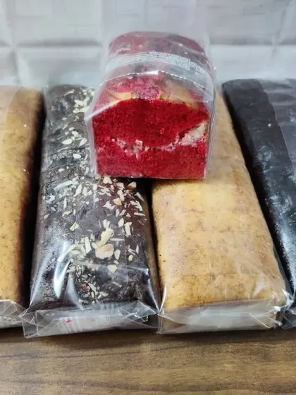 A glimpse of the different loaf cake flavors I offer. This batch includes classic vanilla, rich chocolate, red velvet, and more, all individually wrapped to stay fresh.