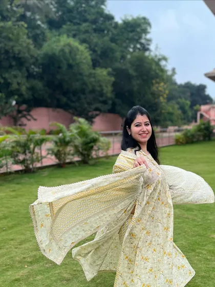 A smile and a spin. In my workshops, we learn the basics of folk dance, focusing on posture, grace, and the joy of movement that defines styles like Rajasthani folk and Garba.