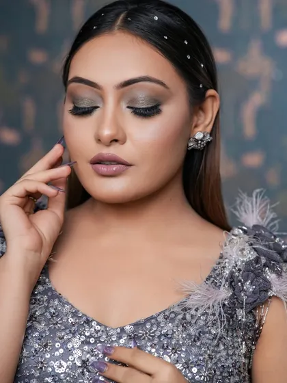 A closer look at the silver smokey eye. The blending is seamless, creating a dramatic effect that makes the eyes pop. This is a great choice for an evening event.