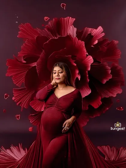 A powerful and artistic portrait using a giant red paper flower as a backdrop. This creates a dramatic and high-fashion look.