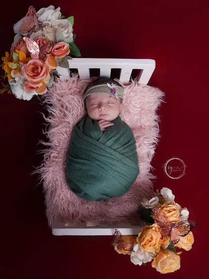 There is nothing more peaceful than a sleeping newborn. I create a calm and safe environment in my studio to capture these delicate first moments, swaddled in soft fabrics and surrounded by beautiful floral props.