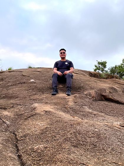 Resting on the unique rock formations of Makalidurga. The terrain itself is a key part of the adventure.