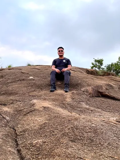 Resting on the unique rock formations of Makalidurga. The terrain itself is a key part of the adventure.