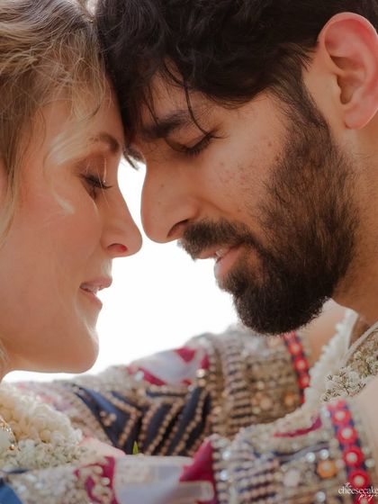 An extreme close-up, capturing the quiet intimacy and connection between the couple.