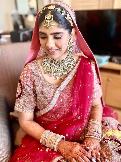 The complete look, with the dupatta perfectly placed over her floral bun.