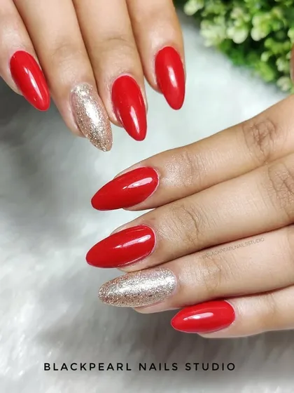 A classic and enchanting combination of bold red nails with golden glitter accent nails. This look is perfect for festive occasions, parties, or a glamorous night out.