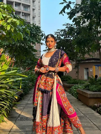 A full-length shot that showcases the unique silhouette of this dhoti-lehenga. It’s a true conversation starter.