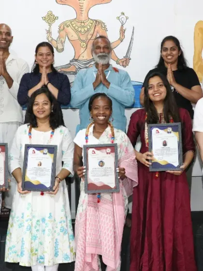 Graduates from our 200 and 500-hour programs, representing the different levels of training we offer.