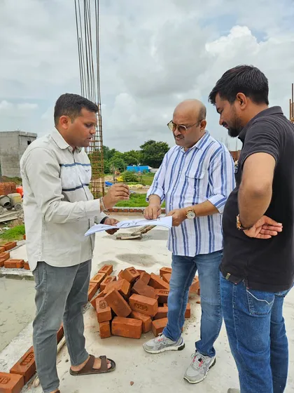 For new constructions, I work directly on-site with the builders and architects, reviewing plans to ensure the structure is aligned with Vastu principles from the very beginning. Here, I am discussing the layout and elemental balance for a new building to prevent future Vastu doshas and ensure a positive energy flow.