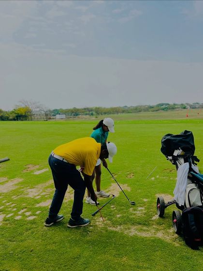 Our coaches are constantly on the range, providing hands-on instruction. From demonstrating a swing path to analyzing a student's setup, these moments of direct mentorship are where real progress is made.