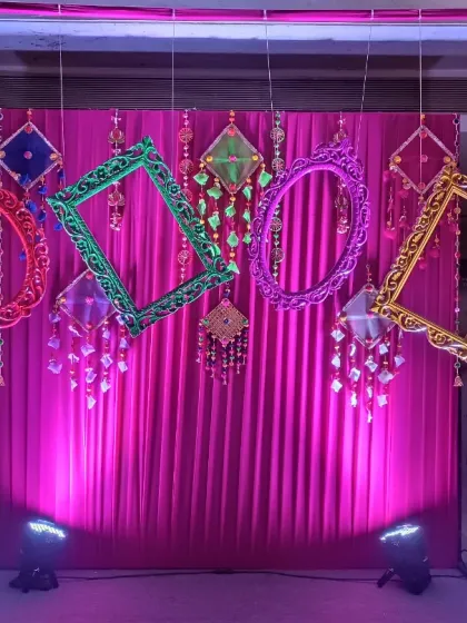 A photo booth is a must for any office party! For this corporate Holi celebration, we designed a fun photo op with a bright pink drape and colourful hanging frames. It’s an easy way to get the team mingling and clicking pictures.