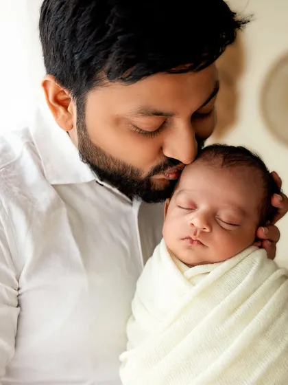 The quiet strength and tenderness of a father's love. Capturing these gentle moments of connection is a core part of my newborn and family photography sessions.
