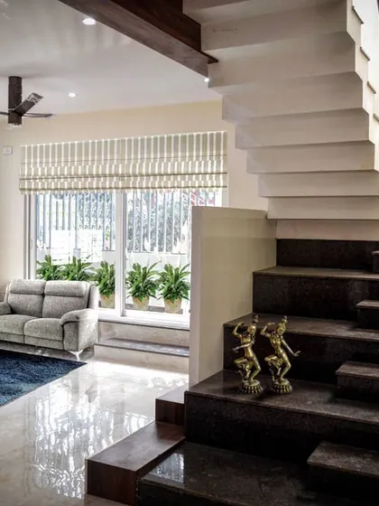 A staircase is more than just a utility; it's a sculpture. For this home, I designed a staircase inspired by the keys of a piano, with alternating black granite and white marble steps creating a playful, rhythmic ascent.