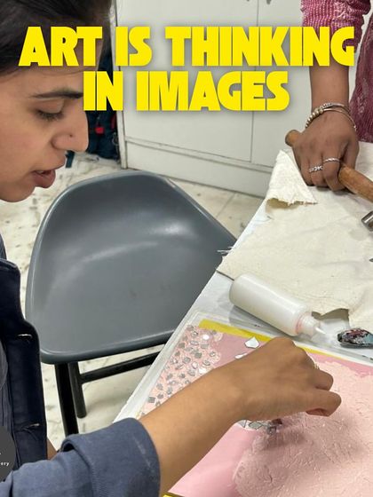 Art is thinking in images. This student is working on a mixed-media craft project, using a hammer to embed decorative elements into her piece.