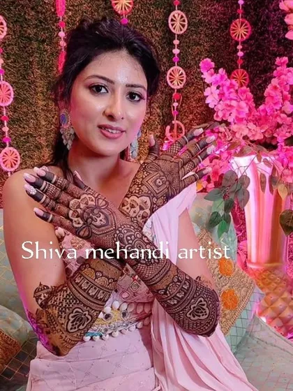 Another view of the elegant floral and paisley mehendi, showing how the design beautifully adorns the hands.