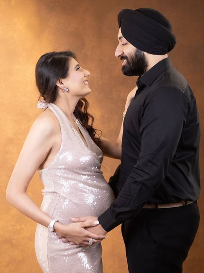 An intimate gaze shared between partners. We guide our clients into poses that feel comfortable and bring out their natural connection, resulting in authentic and emotional photographs.