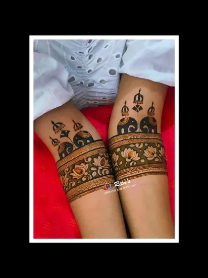 The initial startup design on the arms, featuring majestic elephants under royal umbrellas. This sets the tone for a grand and traditional bridal mehendi.