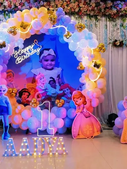 The full stage for the princess-themed first birthday, complete with marquee letters.