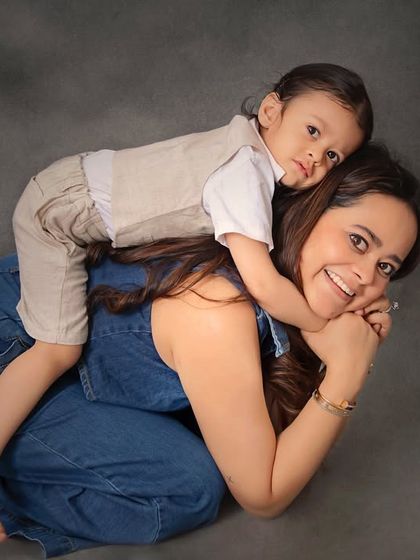 A playful and loving moment between a mother and her son. These candid shots are often the most cherished, capturing the fun and joy of your relationship.