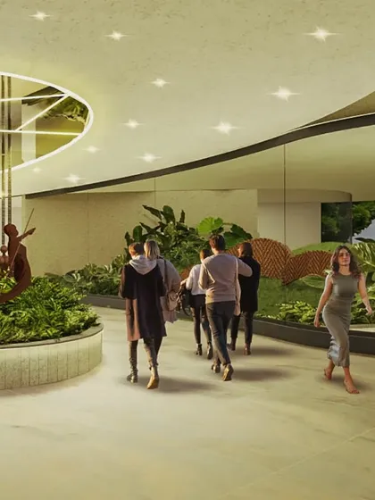 At the Cochin Airport, we designed interior islands with lush greenery and sculptural elements inspired by local culture. The curved ceiling cutout with a mirrored surface reflects the garden below, amplifying the sense of space and light.