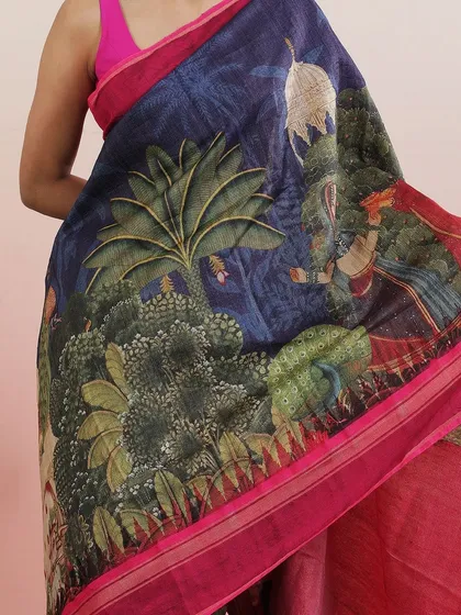 A saree with a beautiful Pichwai-inspired print, featuring lush trees and figures.