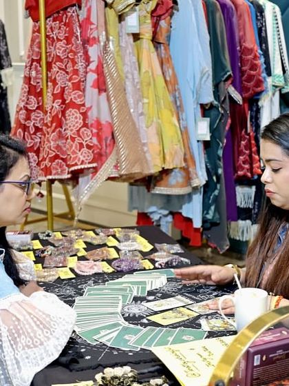 A guest enjoying a tarot card reading during my 'Mom & Me' event. I incorporate unique and entertaining activities like this to ensure my themed gatherings offer a truly memorable and personalized experience for everyone.