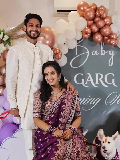 Capturing the happy glow of parents-to-be is what makes my work so special. This photo shows a beautiful couple enjoying their baby shower, surrounded by a custom balloon arrangement I designed to celebrate their journey to parenthood.