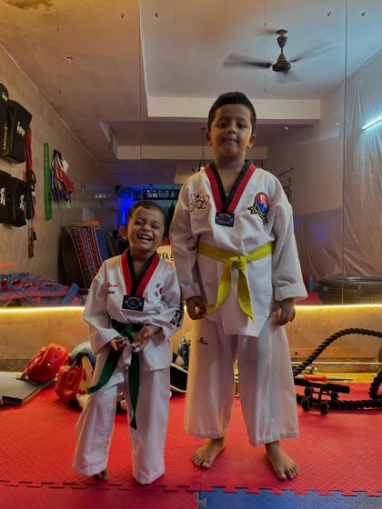 The smiles of happy students are my biggest reward. These two brothers, in their green and yellow belts, show the pride and joy that comes with learning Taekwondo.
