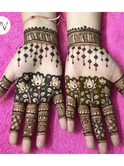 A creative bridesmaid design with hanging diamond shapes and a garden of lotuses on the fingers.