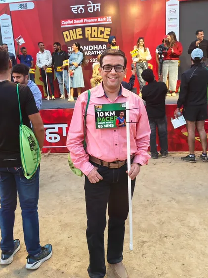 A member at the bib expo, ready to pace the 10k race. We are proud to help other runners achieve their goals.