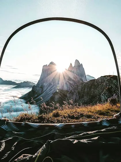 Imagine waking up, unzipping your tent, and being greeted by this. The sun breaking through the peaks, a sea of clouds below you. I find these special hillside spots so you can have a front-row seat to Mother Nature's morning spectacle.