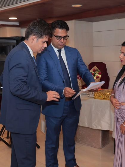 Going over the event schedule with the organizers. Behind every smooth event is careful planning and coordination, ensuring every detail is perfect.