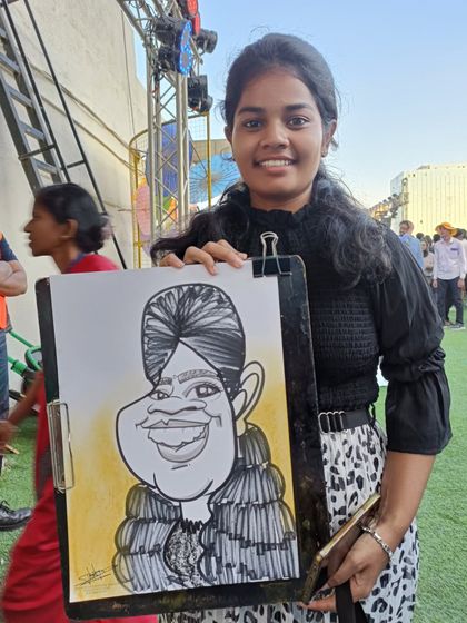 This guest's turban was a beautiful feature to draw, and she was very happy with her portrait.