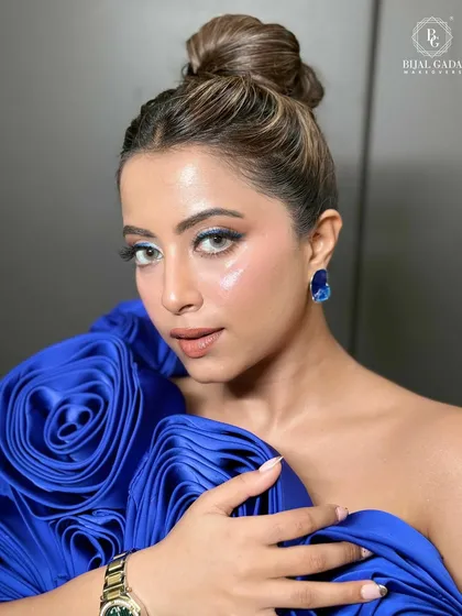 A close-up portrait that captures the radiant glass skin effect. The subtle shimmer on the eyes and glossy lips complete this modern glam look.