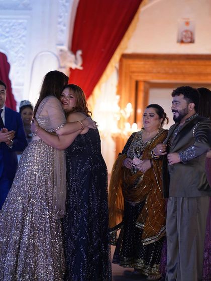 A heartwarming moment of congratulations for the winner. It's a celebration of sisterhood and empowerment.