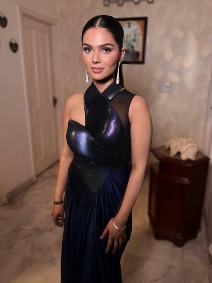 This look proves that less can be luxe. For this modern gown, we did a clean, fresh face with a defined eye and a sleek ponytail for an effortlessly chic vibe.