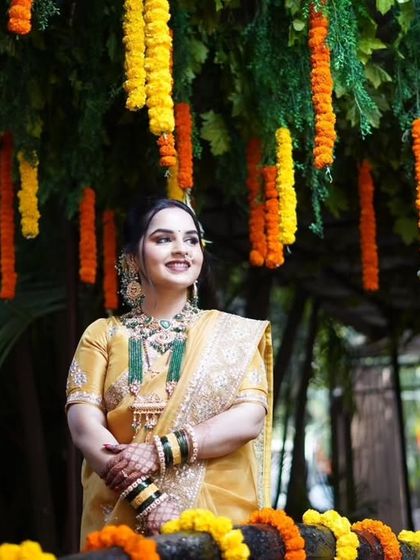 A beautiful outdoor portrait. The bride's mother or sister looks radiant in her traditional attire and elegant makeup.