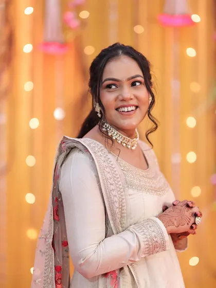 A happy, candid shot that shows off her radiant smile and glowing makeup.