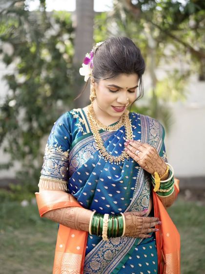 A beautiful candid of the bride admiring her jewelry, a quiet moment before the ceremony.