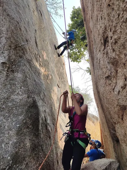 A climber practices her rappelling technique under the watchful eye of our instructors. Repetition and hands on practice are key to mastering these skills.